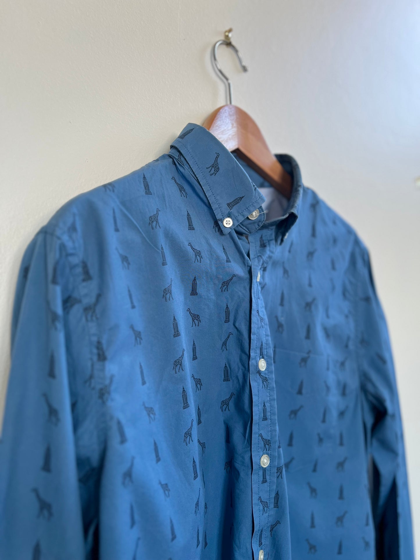 "Banana Republic" blue shirt with giraffe and building - Size M